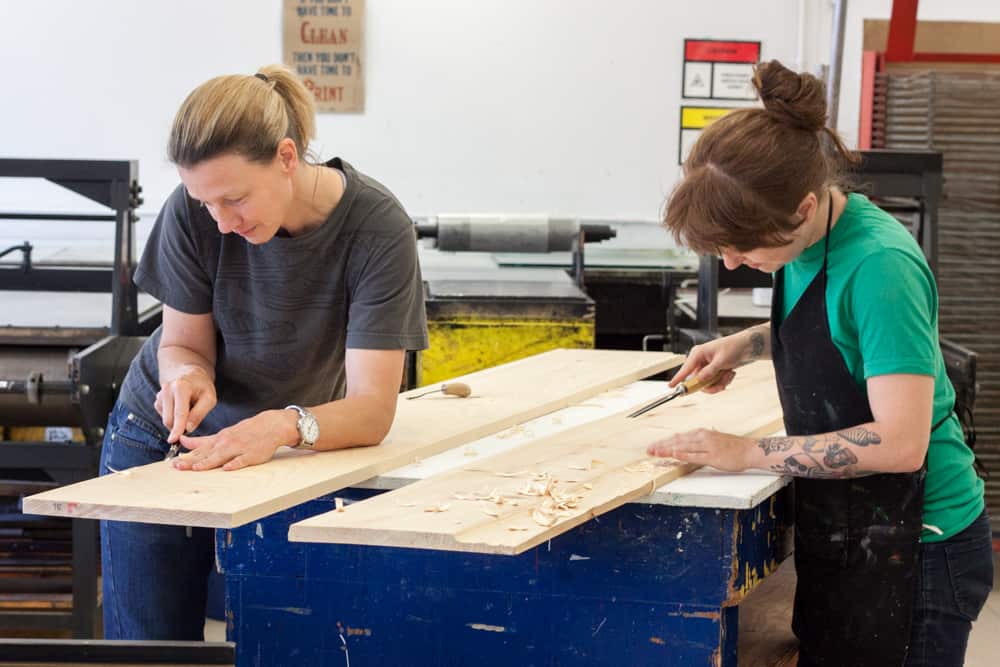 Alison Judd and Susan Van Der Beek preparing the logs for printing.
