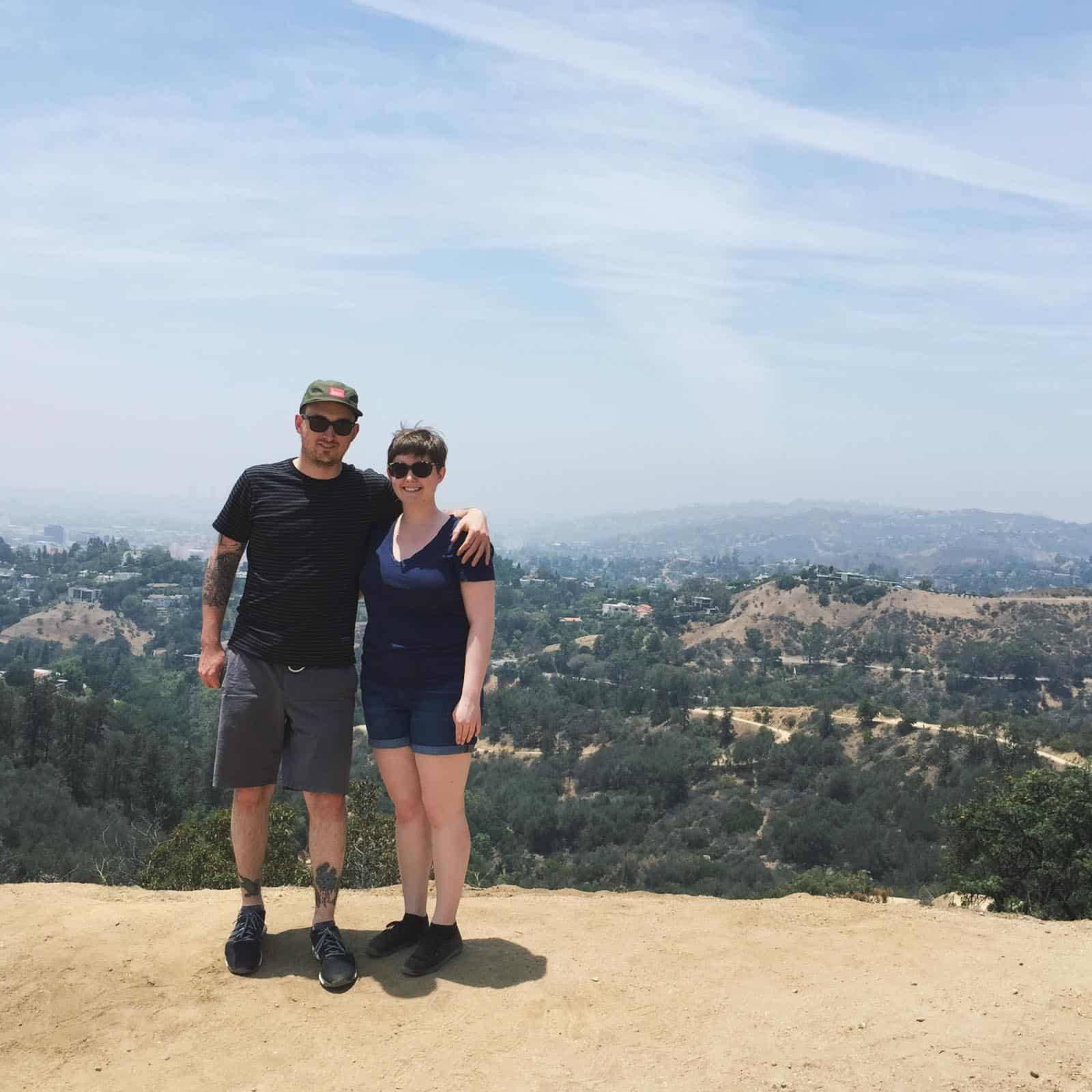 melissa and julian standing in front of california hills
